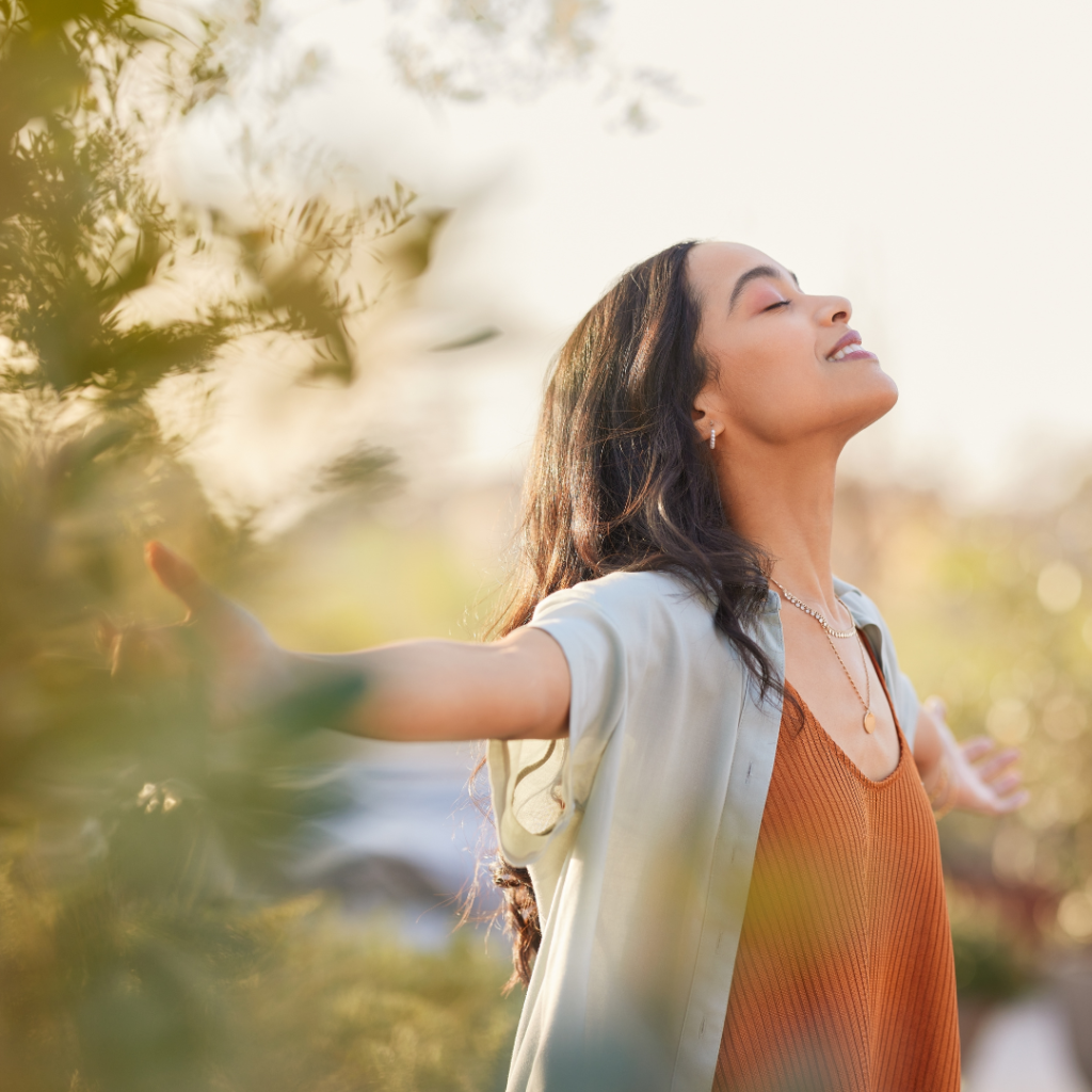 Serene latin woman enjoy sunset with gratitude