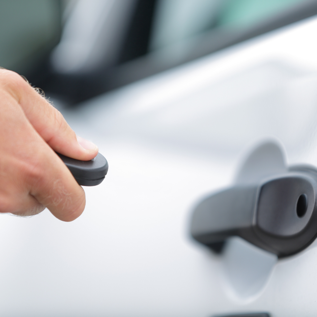 Man Locking Car Door Using Remote Control Key Fob
