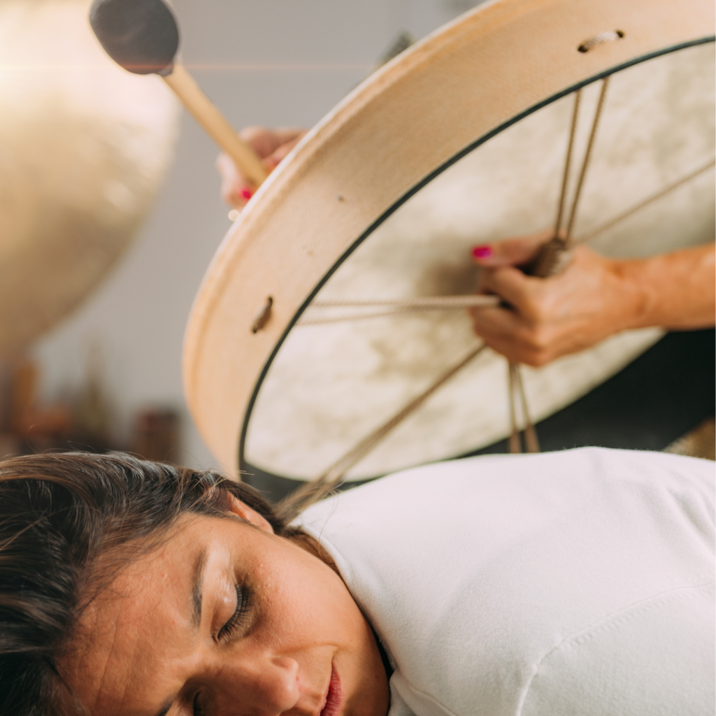 Sound Therapy Drum. Playing Native American Hide Drum In Sound Healing Therapy