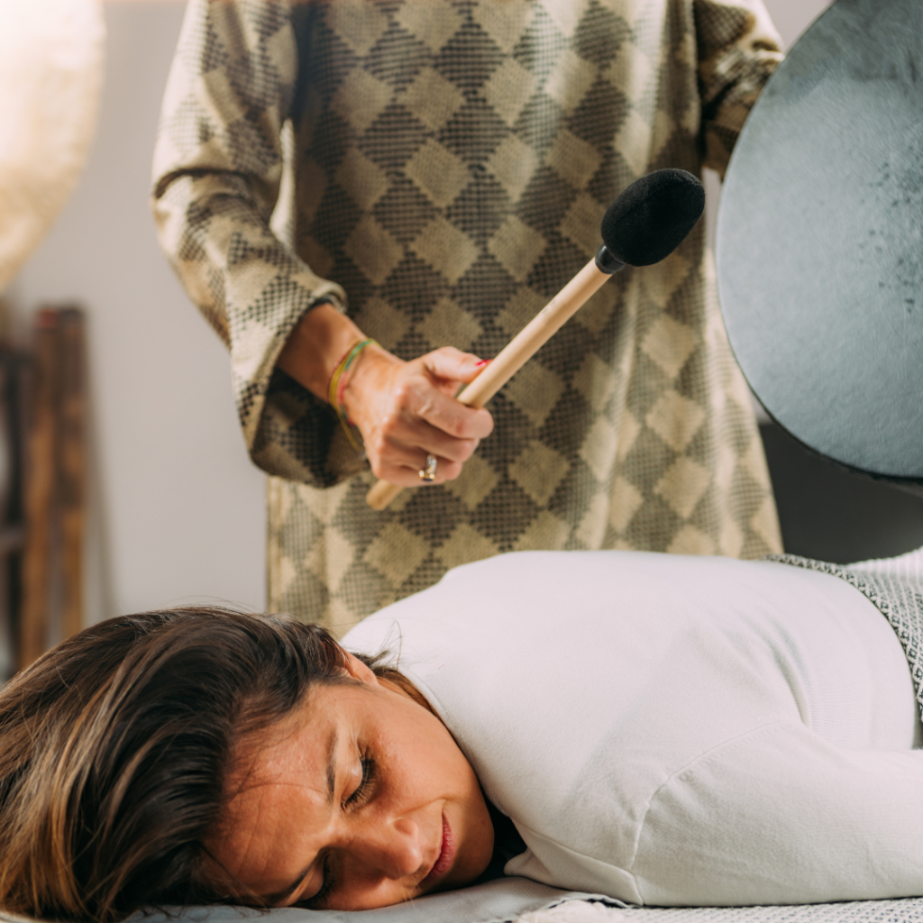 Playing Moon Drum In A Sound Healing Therapy Session
