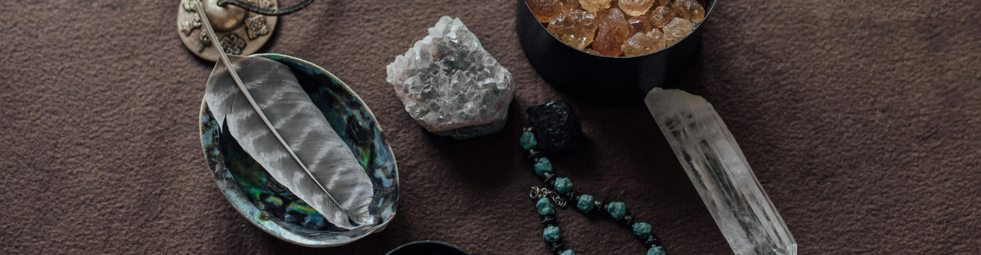 A Close-Up Shot of Healing Crystals and a Tingsha