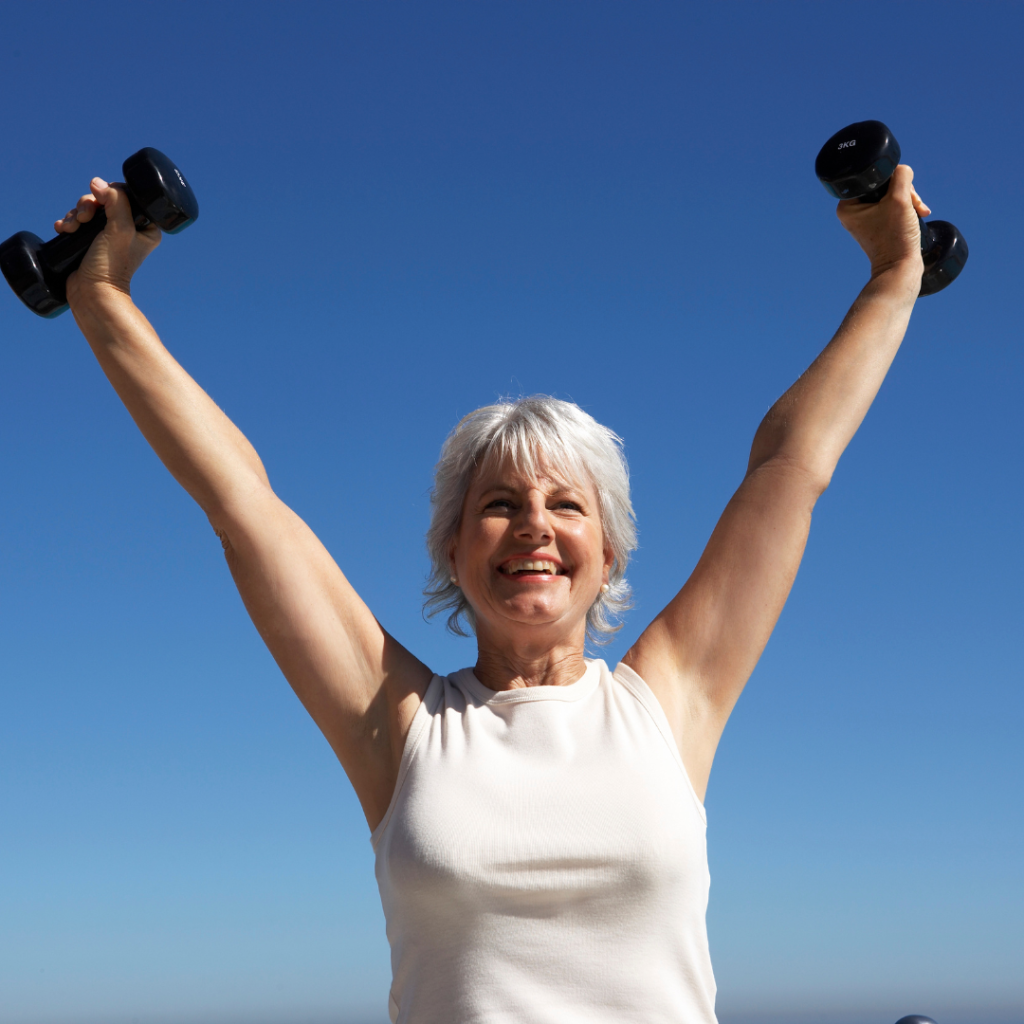 Energetic woman lifting dumbbells