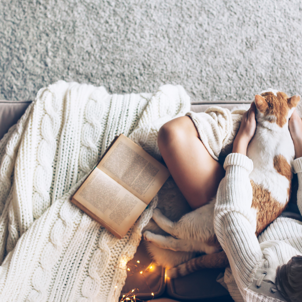 Girl with Cat Relaxing on a Couch