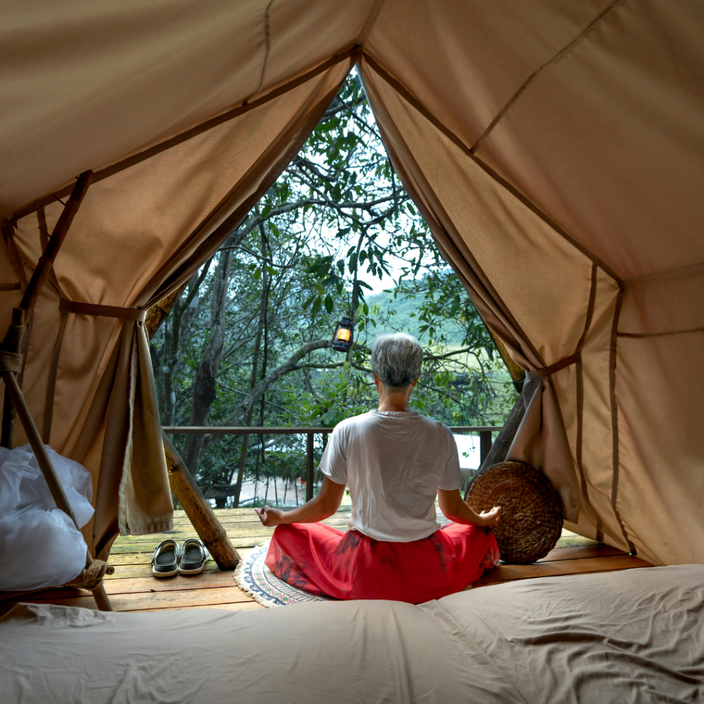 Woman Meditating in a Tent