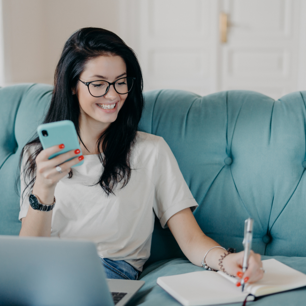 Female Copywriter Concentrated on Remote Job, Prepares Publication, Watches Webinar to Improve Skills, Reads Message, Installs New Application, Uses Free Internet Connection, Smiles Happily.