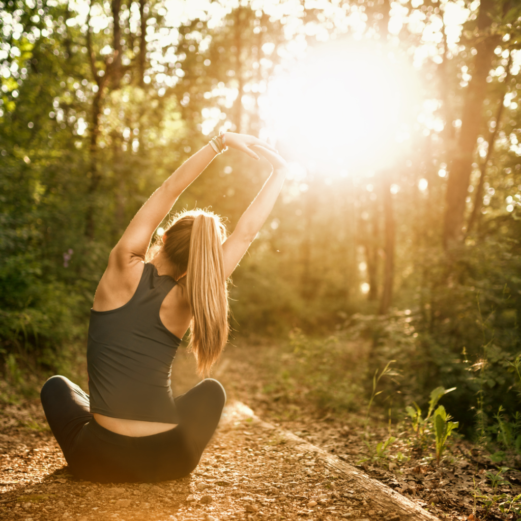 Young woman meditacion in nature and practicing yoga