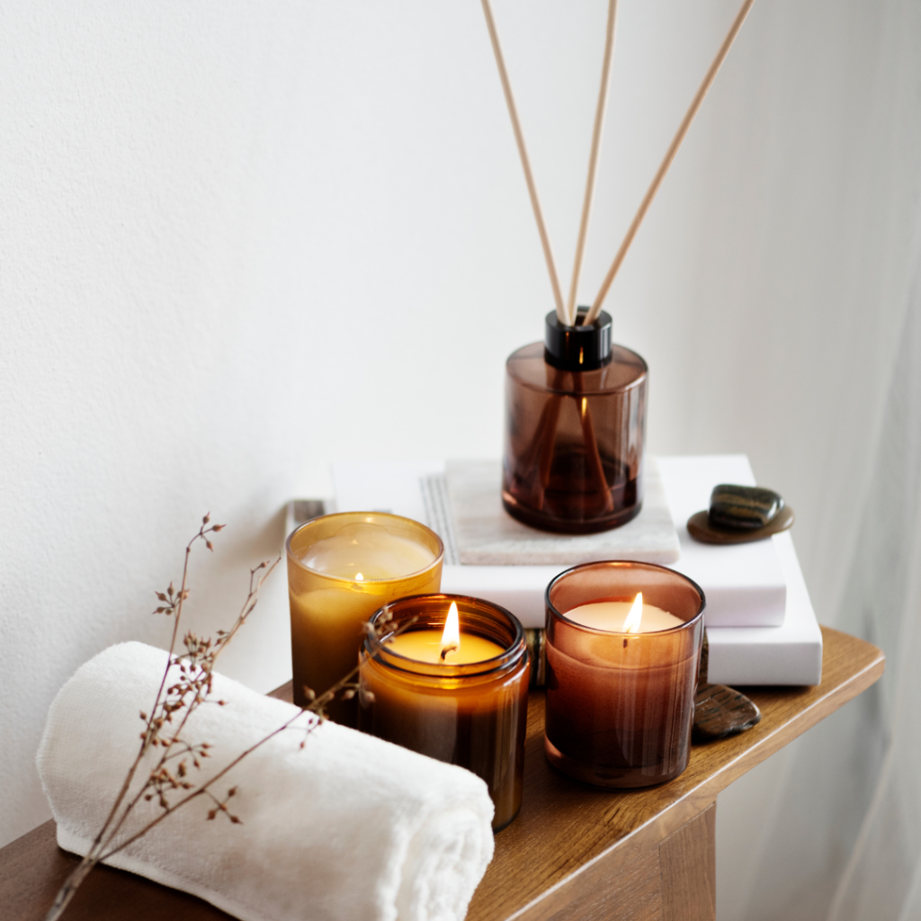Aromatherapy table setting with scented candles and towel