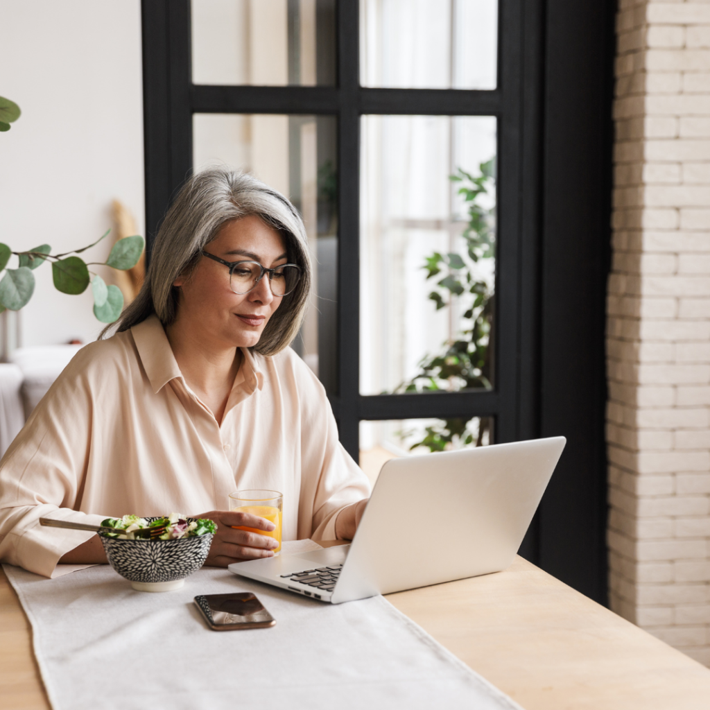 Concentrated Business Woman Using Laptop Computer