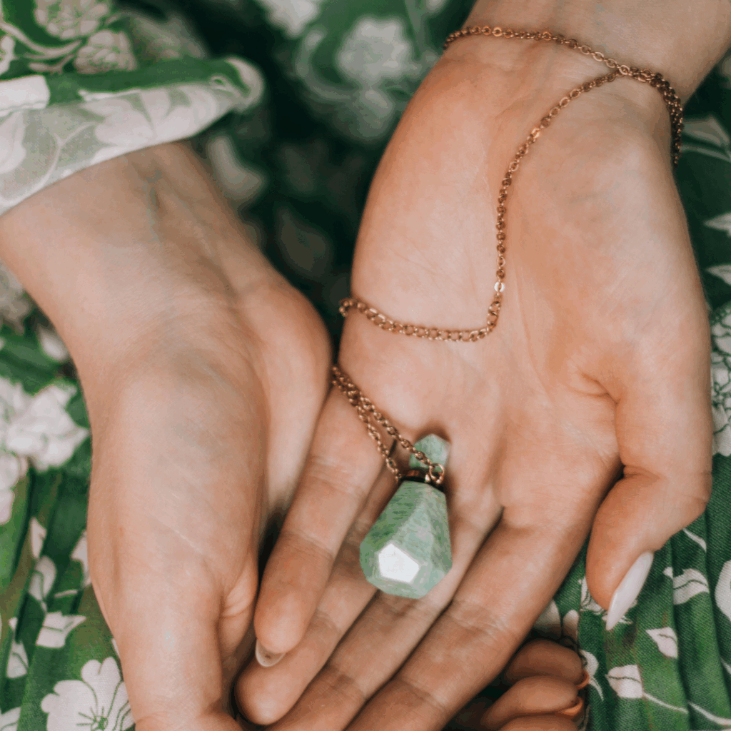 Woman Hands Holding Crystal Bottle Jewelry