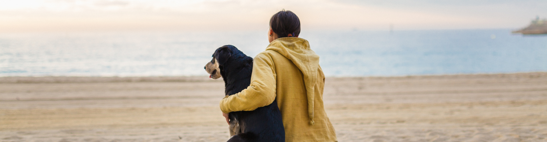 Woman hugging her dog