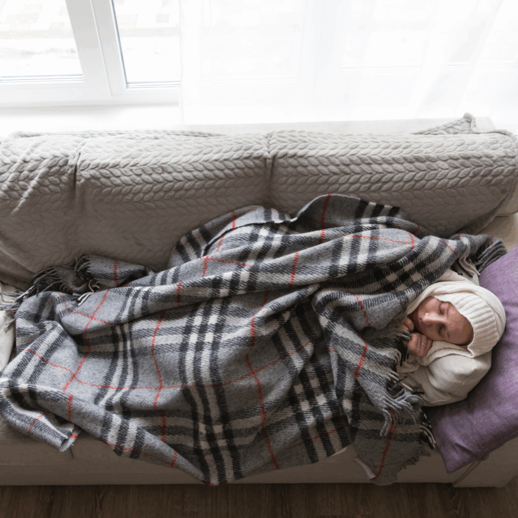 Sick Woman Sleeping on the Couch