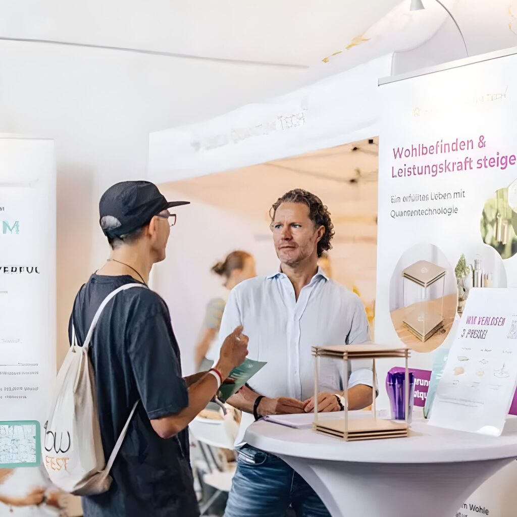 Philipp speaking to an event attendee at FlowFest.