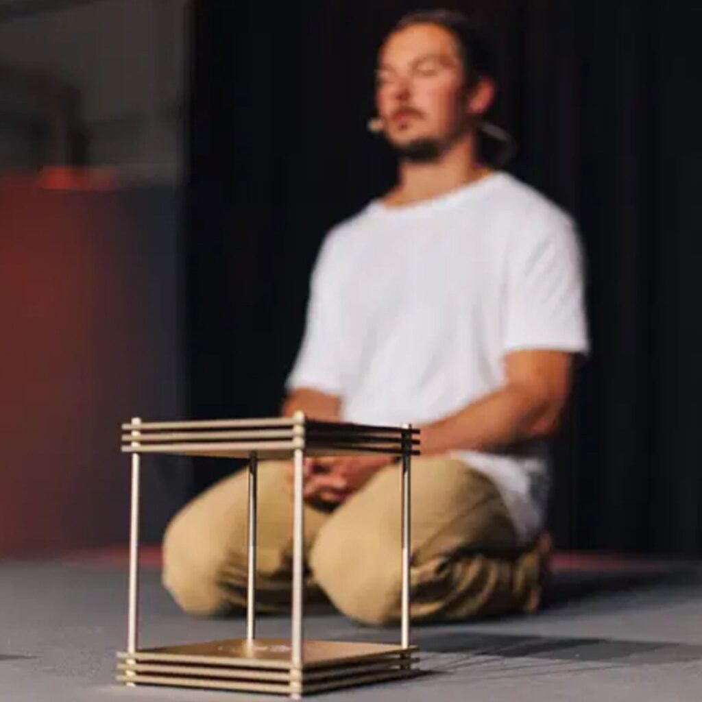 Leading a meditation session with an Infinity Bloc from Leela Quantum Tech.