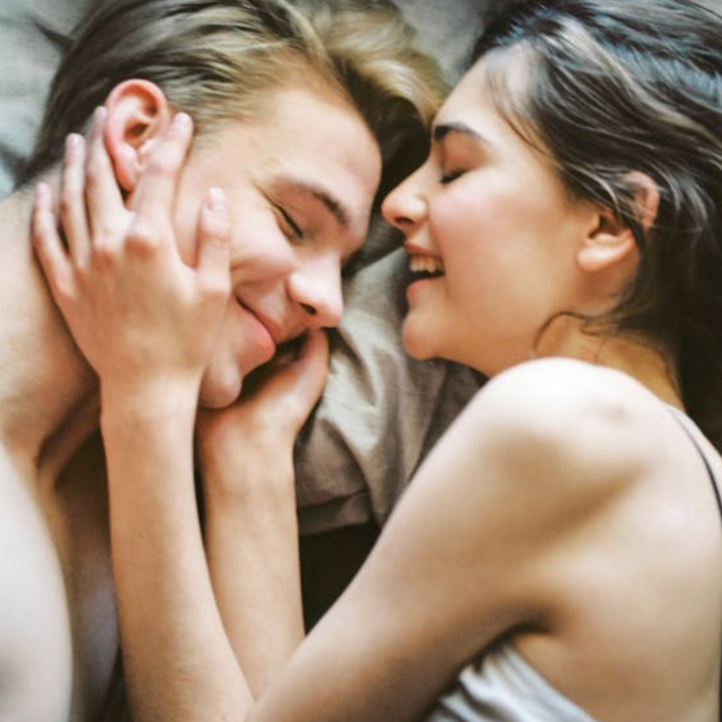 Man and Woman Lying on Bed